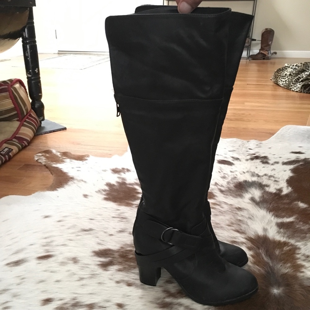 Black high heeled zip up boots